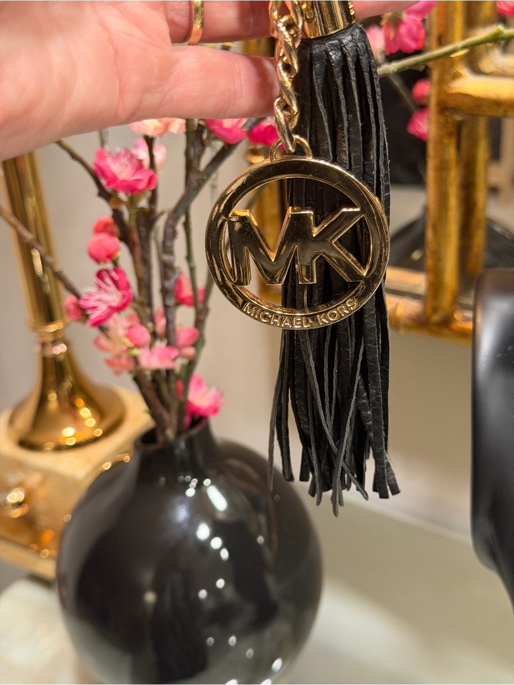 Michael Kors EUC Hang gold emblem tag + leather tassel